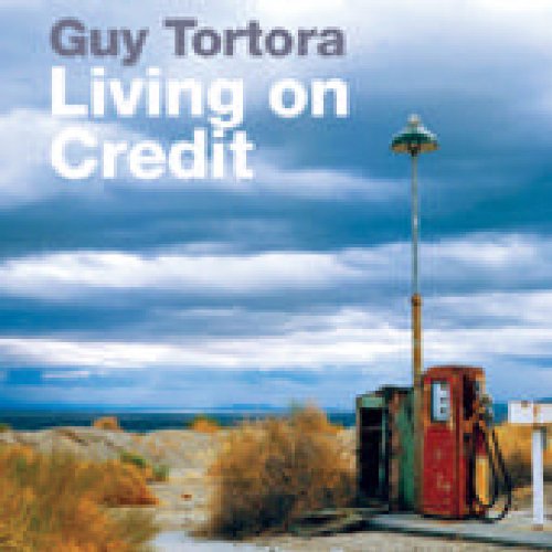 "Album cover with old gas pump and cloudy sky, titled 'Living on Credit' by Guy Tortora."