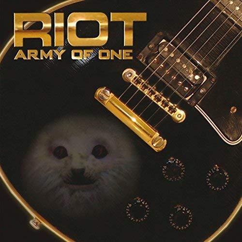 "Black electric guitar with gold hardware and white cat face on the body."