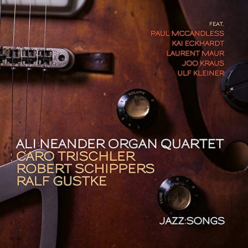 "CD cover featuring a close-up of a guitar with text overlay listing the artists."