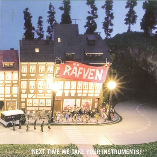 A miniature building with a red banner reading "Rafven" and a crowd outside at night.