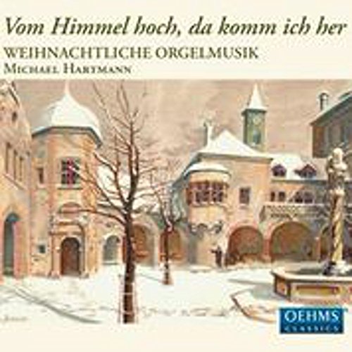 "Christmas CD cover featuring winter courtyard scene with snow-covered buildings and a fountain."