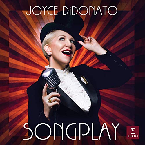 "Album cover featuring Joyce DiDonato in a black hat and tuxedo, holding a microphone."
