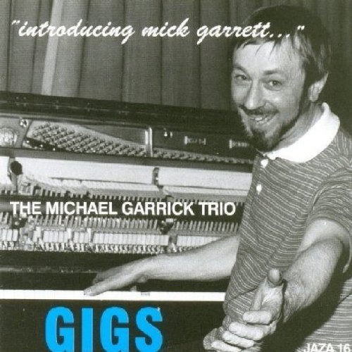 Black and white CD cover with man standing by a piano.