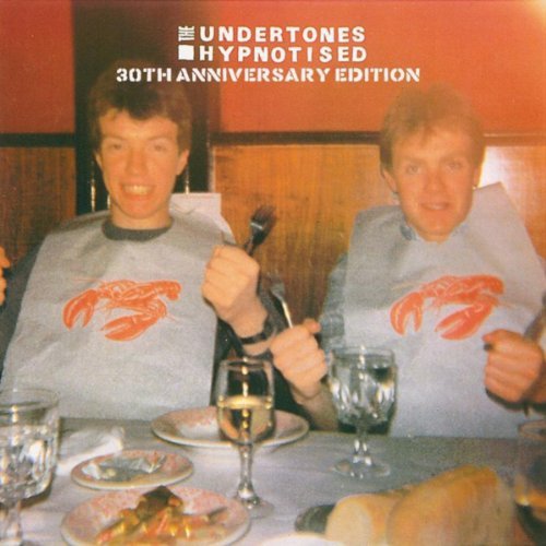 Vinyl album cover featuring two men wearing bibs with lobsters, sitting at a dinner table.