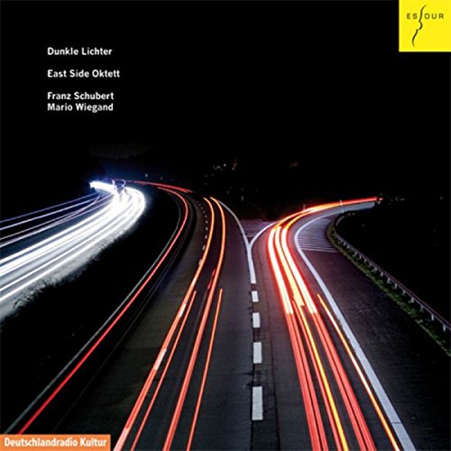 "CD cover featuring a dark highway with blurred red and white car lights."