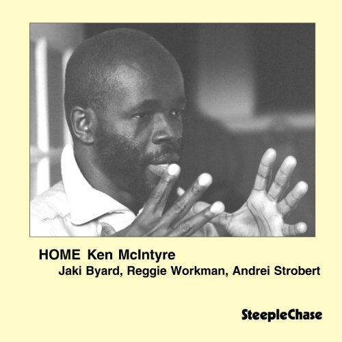 Album cover with black and white photo of man gesturing, on pale yellow background.