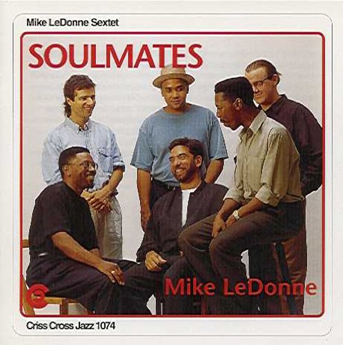 "CD cover featuring a group of six men posing together, wearing casual clothing."