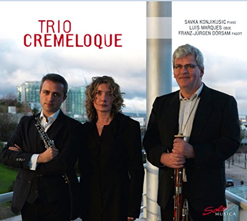 CD cover featuring three men in suits holding musical instruments, with cityscape in background.
