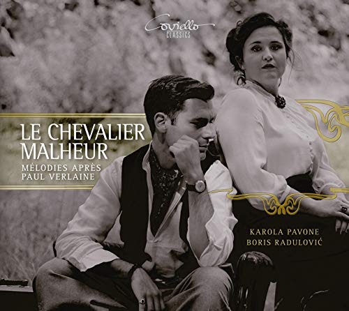 "Black and white CD cover with man and woman sitting together outdoors."