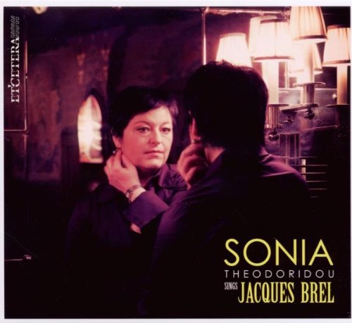 "CD cover with a man and woman embracing, dimly lit background, text at the bottom."