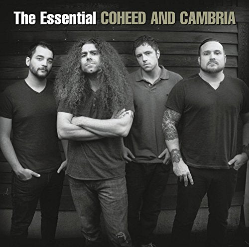 Black and white album cover with four men standing against a wooden wall.
