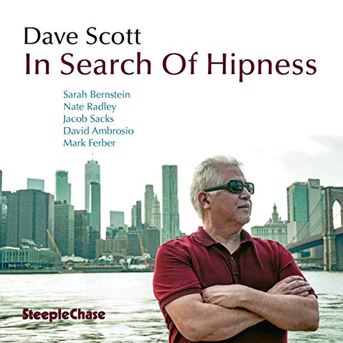"Album cover with a man in sunglasses and a city skyline in the background."