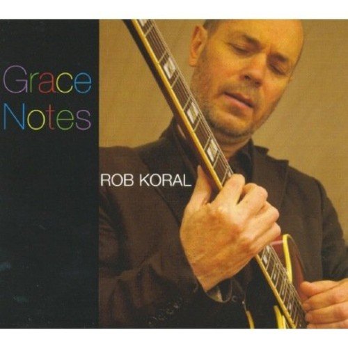 "CD cover with a man playing guitar, titled 'Grace Notes' by Rob Koral."