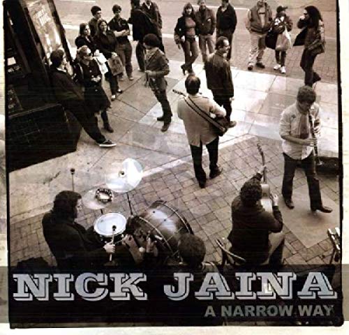 Vinyl album cover with black-and-white photo of street musicians and onlookers.