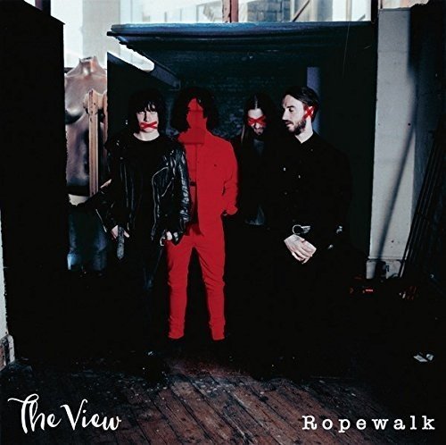 Album cover featuring four men standing in a dark doorway, one highlighted in red.
