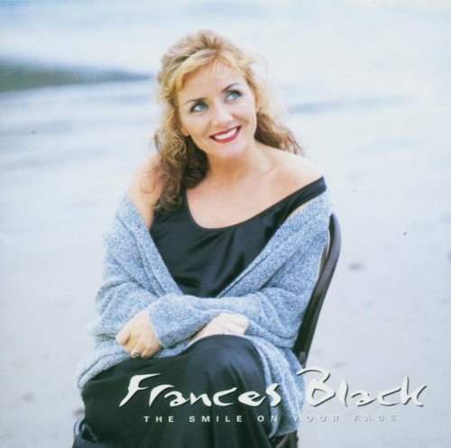 "CD cover featuring a woman sitting on a chair on a sandy beach."