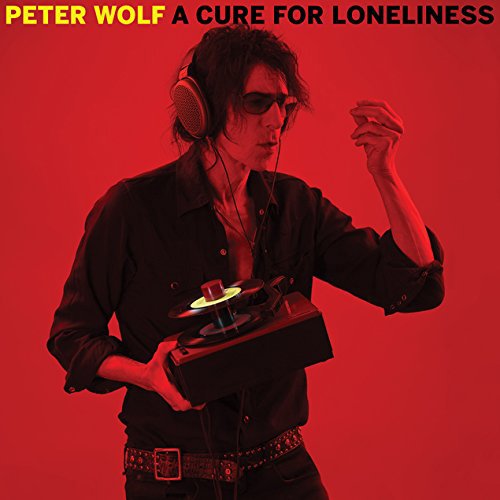 Man wearing headphones holds a record player against a red background with album title.