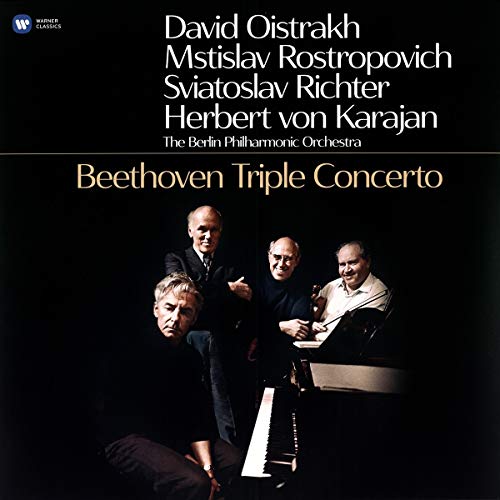 "Vinyl record cover featuring four musicians, with black background and gold and white text."