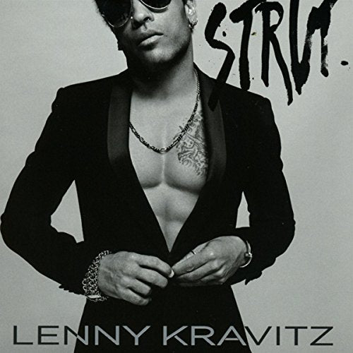 "Album cover featuring Lenny Kravitz in a black suit, unbuttoning his jacket, with 'Strut' written."