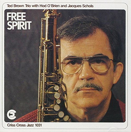 Album cover with a man holding a saxophone, wearing glasses and a mustache.