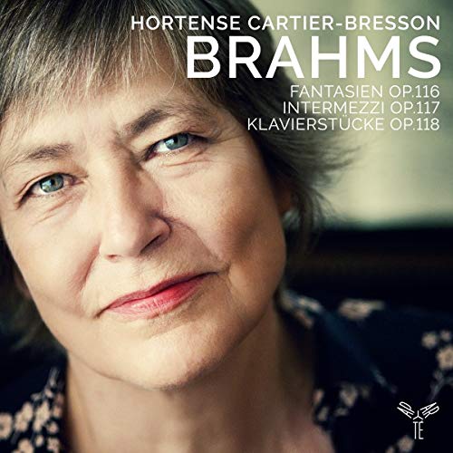 CD cover featuring a close-up of a woman's face with text overlay.