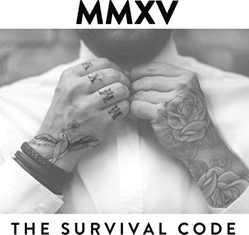 Black and white image of a man adjusting his shirt, showcasing tattoos on his hands.