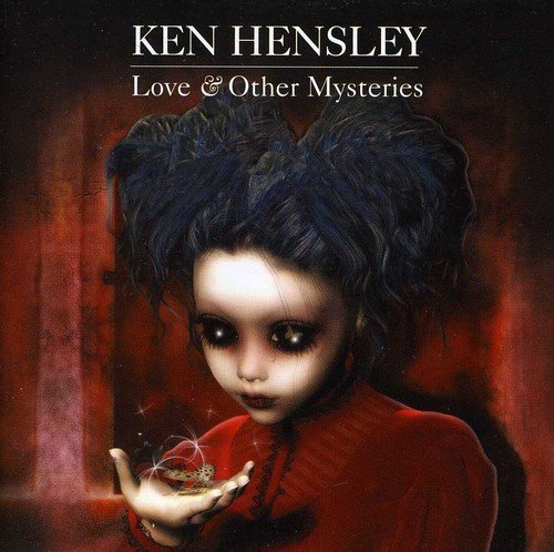 The alt text for the image is: "CD cover with a woman holding a glowing heart."