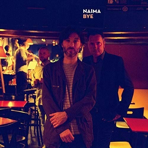 "Album cover with two men standing in a dimly lit bar with red tables."