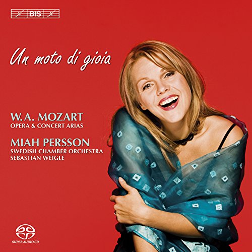 The image shows a red CD cover featuring a smiling woman in a blue dress.