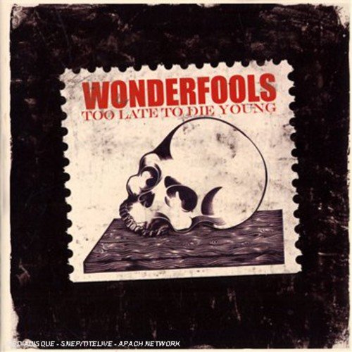 "Album cover featuring a postage stamp with a skull on a wooden surface."