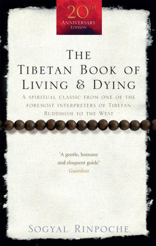 The image depicts a book cover with a white, torn-paper design. Alt text: Book cover with white, torn-paper background and brown prayer beads.