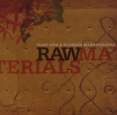 "CD cover with brown background, red leaves, and 'Raw Materials' in bold font."