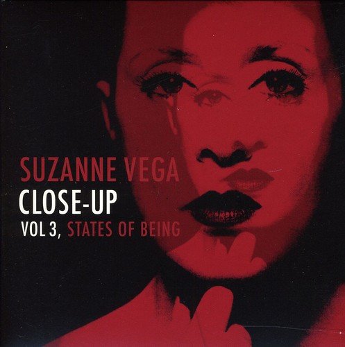 "Suzanne Vega's album cover featuring a red-toned close-up portrait of a woman."