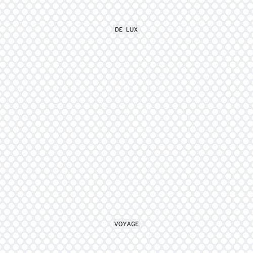 A white square with a pattern of small circles and the text "DE LUX" and "VOYAGE".