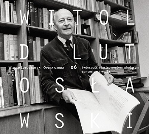 Black and white image of a man sitting by a bookshelf, holding sheet music.