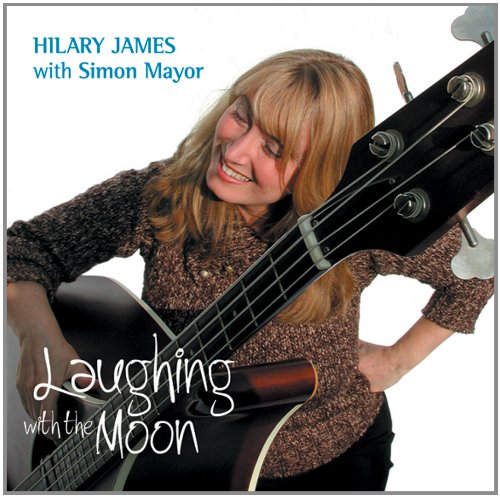 Album cover featuring a woman holding a guitar, with text "Laughing with the Moon".