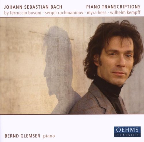 CD cover featuring a man in a grey jacket and black turtleneck.