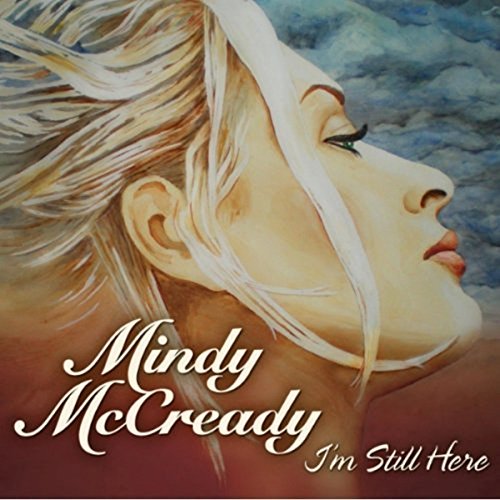 "Album cover featuring a blonde woman's face with hair blowing in the wind."