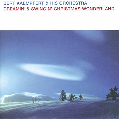 "Album cover featuring a snowy landscape with trees and a blue sky."