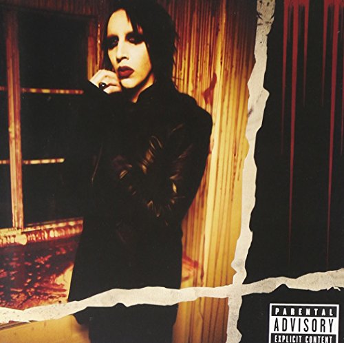 "Marilyn Manson album cover featuring a man in black, with a torn edge effect."