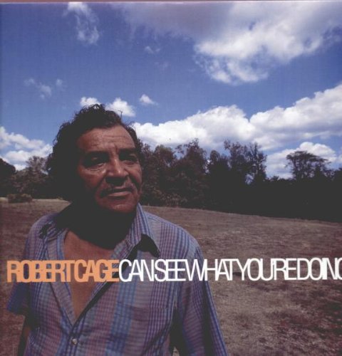 "Album cover featuring Robert Cage in a field with blue sky and trees."