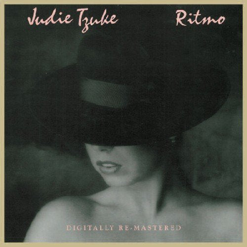 "Album cover featuring a woman wearing a hat, obscuring her eyes, in black and white."