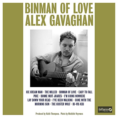 Album cover with black and white photo of man playing guitar, green and white design.