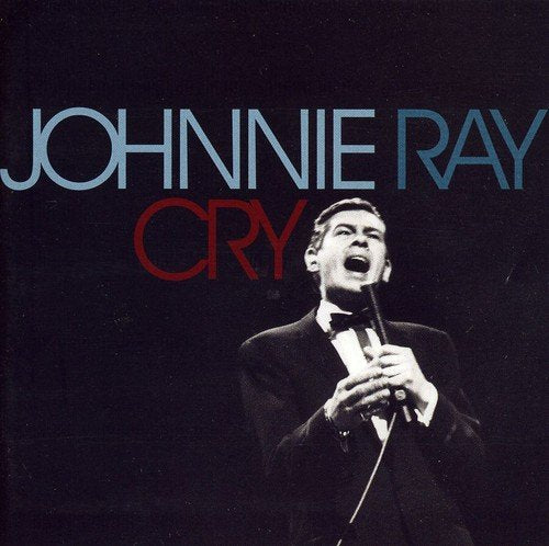 "Album cover featuring Johnnie Ray singing into a microphone, with 'Johnnie Ray Cry' text."