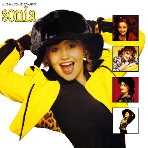 Sonia's album cover: woman in yellow jacket and black hat against a white background.