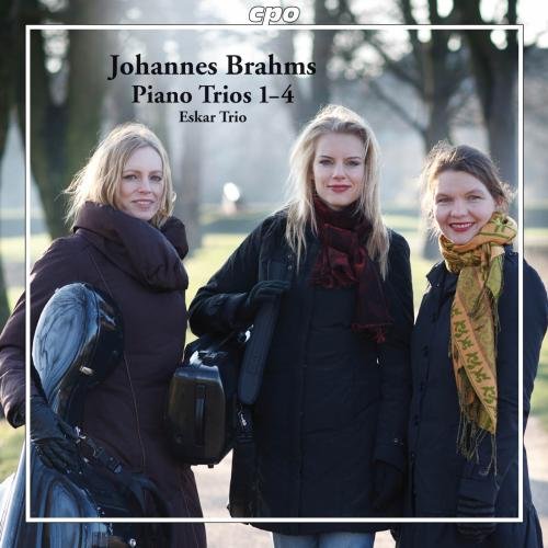"CD cover featuring three women in coats and scarves standing outdoors."