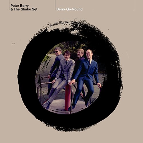 Album cover with three men on a roundabout, beige background, black circular frame.