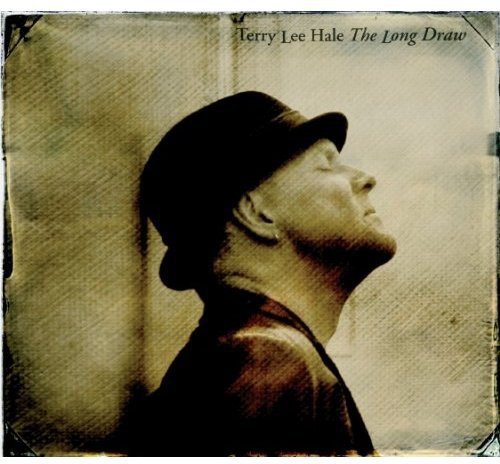 Sepia-toned album cover with a man wearing a cap, looking upwards, against a textured background.