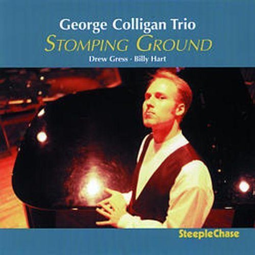 "Album cover featuring a man playing piano, with blue background and yellow text."
