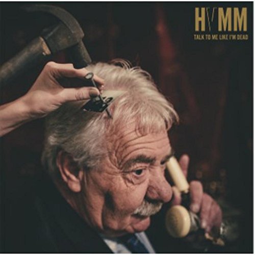 Vinyl album cover featuring an older man being threatened with an axe.